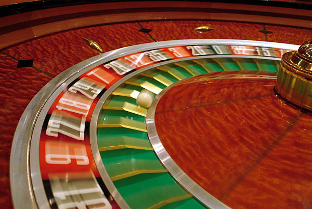 Baccarat card layout showing player and banker hands at Singapore Pools table
